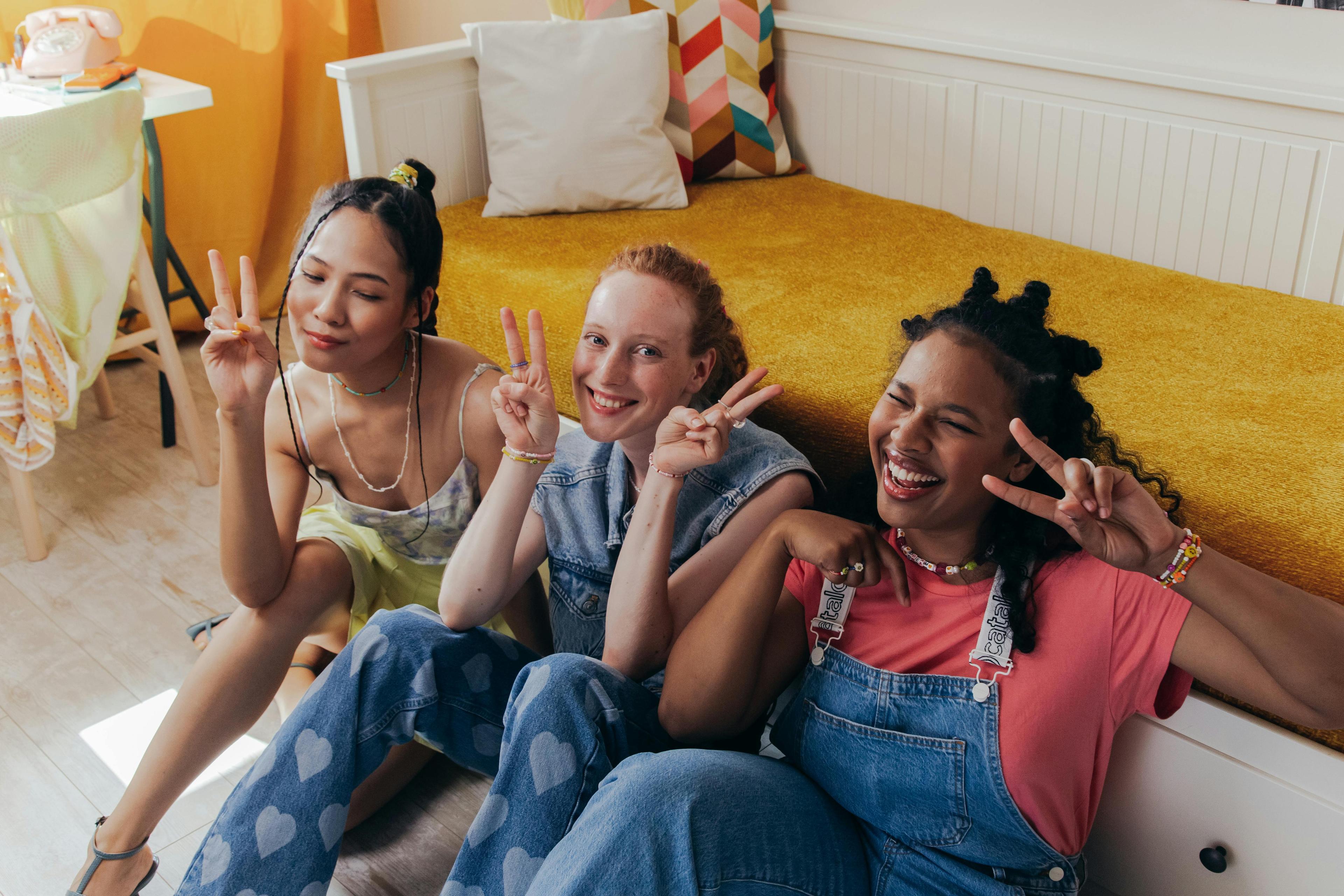 Three young people sitting together representing youth-centered approach